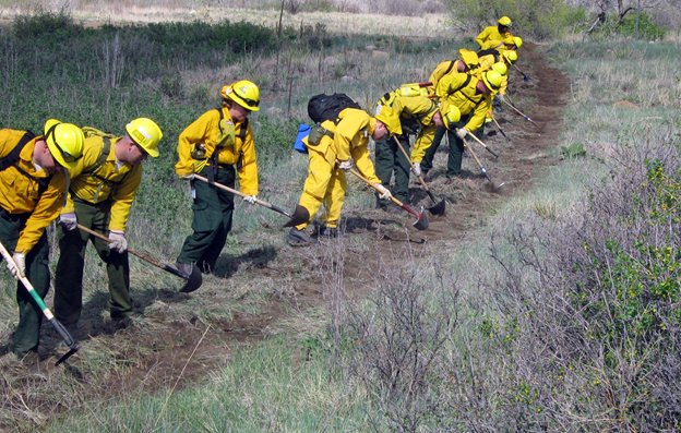 firefighters digging a fireline